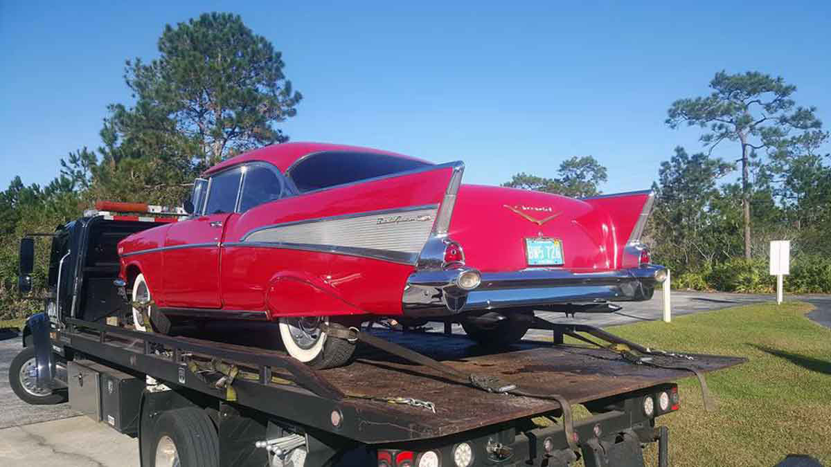 Classic Red Chevy Car on flatbed tow truck