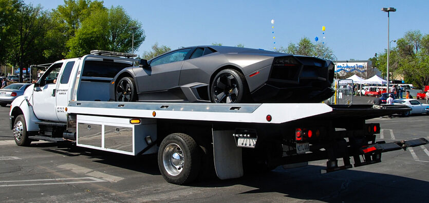 Lamborghini car on flatbed tow truck